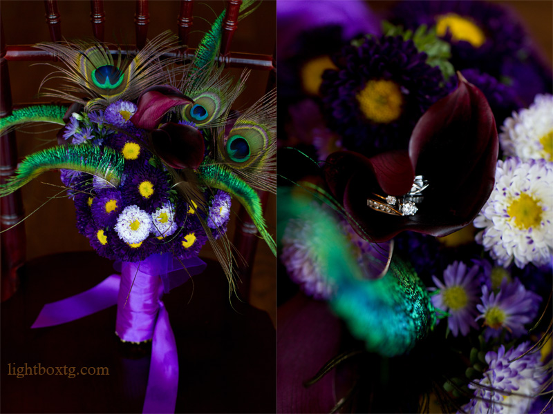 purple bridal bouquest with peacock feathers and wedding rings