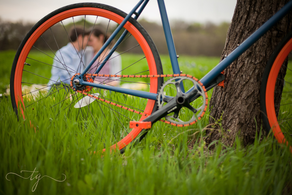 couple behind bkie tire